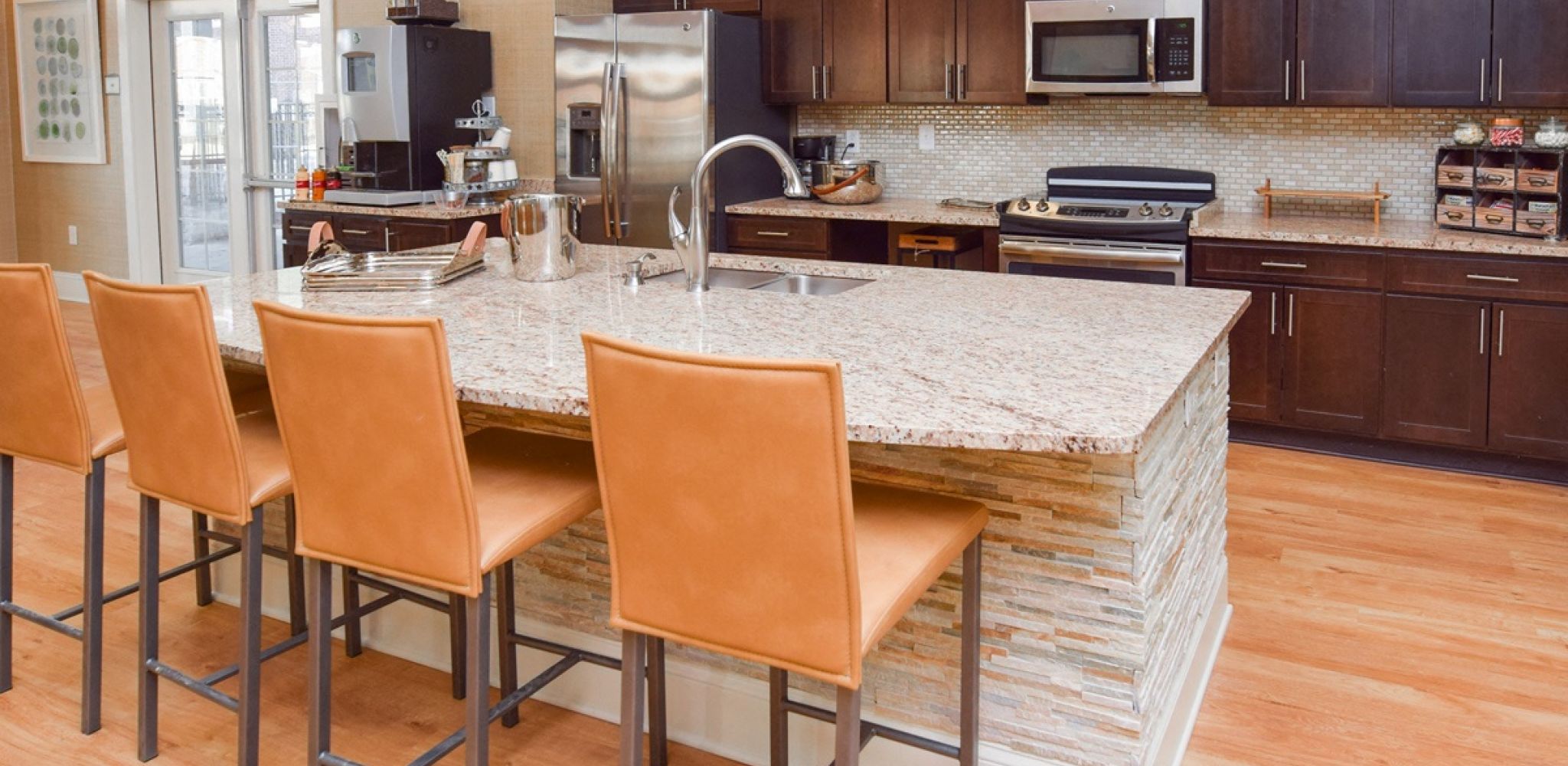 Hawthorne at the Summit resident clubhouse amenity with kitchen seating area and beautiful finishes