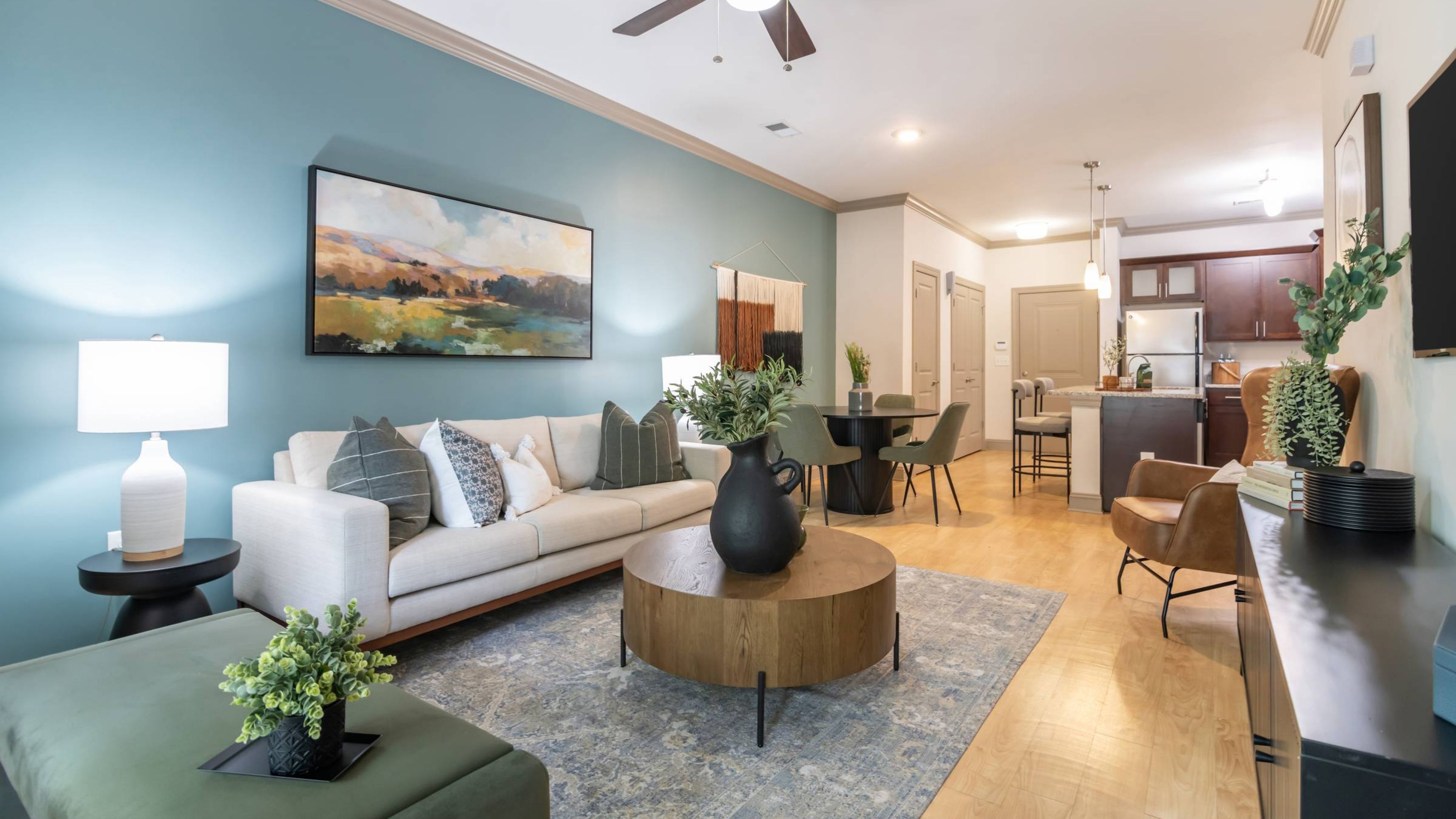 Hawthorne at the Summit modern apartment living space and kitchen with kitchen island, granite countertops, stainless steel appliances, 9ft ceilings